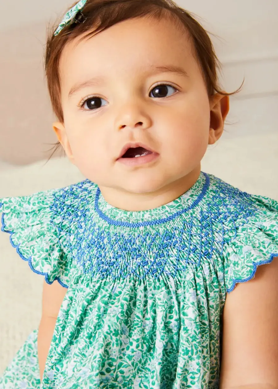 Pepa London Adelaide Floral Hand Smocked Sleeveless Dress With Bloomers in Green (3mths-3yrs) | Openwork Cotton Cardigan in Cream (6mths-10yrs) | Leather Mary Jane Pram Shoes in Ivory (17-20EU) | Adelaide Floral Small Bow Hair Clip in Green | Openwork short socks White (0mths-8yrs) | Flower Fairies of the Spring Book in White