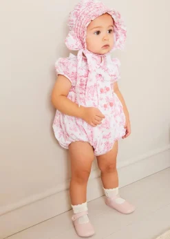 Pepa London Audrey Hand Smocked Double Breasted Short Sleeve Romper in Pink (6mths-2yrs) | Audrey Toile Hand Smocked Bonnet in Pink (S-M) | Openwork Cotton Cardigan in Pink (6mths-10yrs) | Mary Jane Pram Shoes in Pink (17-20EU) | Openwork short socks White (0mths-8yrs)