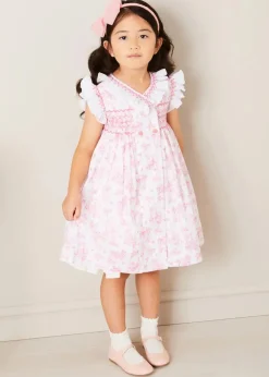 Pepa London Audrey Toile Hand Smocked Double Breasted Sleeveless Dress in Pink (12mths-10yrs) | Peter Pan Collar Swing Coat in Pink (18mths-10yrs) | Openwork Cotton Cardigan in Cream (6mths-10yrs) | Leather Mary Jane Shoes in Pink (24-34EU) | Traditional Big Bow Tulle Hairband in Dusty Pink | Openwork short socks White (0mths-8yrs)