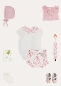 Pepa London Audrey Toile Scallop Collar Short Sleeve Bodysuit in Pink (1mth-2yrs) | Audrey Toile Bow Detail Bloomers in Pink (1mth-2yrs) | Openwork Cotton Cardigan in Pink (6mths-10yrs) | Openwork Cotton Knitted Bonnet in Pink (S-L) | Mary Jane Pram Shoes in Pink (17-20EU) | Audrey Toile Dummy Clip in Pink | Openwork short socks White (0mths-8yrs) | BIBS Dummy in Pink
