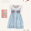 Pepa London Charlotte Floral Hand Smocked Sleeveless Dress in Blue (12mths-10yrs) | Openwork Cotton Cardigan in Cream (6mths-10yrs) | Girls Ivory Leather Mary Jane Shoes (20-34EU) | Plain Linen Hairband in Red | Openwork short socks White (0mths-8yrs)