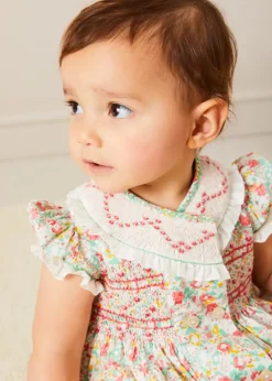 Pepa London Clementine Floral Hand Smocked Double Breasted Short Sleeve Romper in Coral (6mths-3yrs)