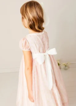 Pepa London Constance Floral Hand Smocked Short Sleeve Party Dress in Pink (12mths-10yrs) | Openwork Cotton Cardigan in Cream (6mths-10yrs) | Leather Charlotte Shoes in Gold (24-35EU) | Tulle Long Bow Clip In Cream | Celebration Short Socks with Ruffle- Cream (0mths-10yrs)