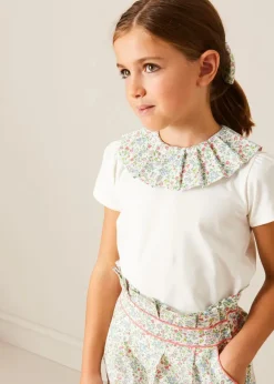 Pepa London Cordelia Floral Collar Top in Pink Made with Liberty Fabric (2-10yrs) | Cordelia Floral Shorts in Pink Made with Liberty Fabric (4-10yrs) | Floral Openwork Cotton Cardigan in Pink (2-10yrs) | Canvas Plimsolls in Cream (20-35EU) | Cordelia Floral Medium Bow Clip in Pink Made with Liberty Fabric