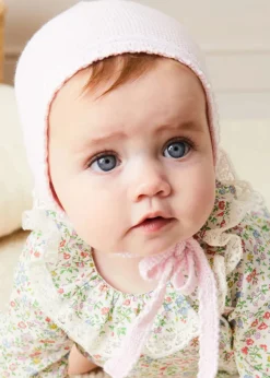 Pepa London Cordelia Floral Long Sleeve Blouse in Pink Made with Liberty Fabric (1-12m) | Cordelia Floral Bloomer with Bow in Pink Made with Liberty Fabric (1m-2yrs) | Openwork Detail Baby Cardigan in Pink (1-12mths) | Lace Detail Knitted Bonnet in Pink (1-12mths) | Lace Detail Knitted Booties in Pink | Cordelia Liberty Floral Dummy Clip in Pink | BIBS Dummy in Pink