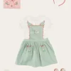 Pepa London Duck Embroidered Scallop Detail Skirt With Braces in Green (18mths-6yrs) | Hand Smocked Collar Short Sleeve Blouse in White (18mths-6yrs) | Strawberry Embroidery Cardigan in Pink (12mths-6yrs) | Mary Jane Baby Shoes in Pink (20-26EU) | Raspberry Linen Hairband