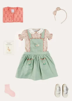 Pepa London Duck Embroidered Scallop Detail Skirt With Braces in Green (18mths-6yrs) | Mabel Floral Embroidered Short Sleeve Blouse in Coral (18mths-10yrs) | Floral Openwork Cotton Cardigan in Pink (2-10yrs) | Mary Jane Leather Baby Shoes in Ivory (20-24EU) | Mabel Floral Hairband in Coral | Openwork short socks - Dusty Pink (0mths-10yrs)