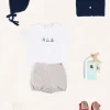 BOY Pepa London Embroidered Boat Motif Peter Pan Collar Bodysuit in White (1mth-3yrs) | Beaufort Striped Button Detail Bloomers in Red (3mths-3yrs) | Plain Cardigan in Navy (6mths-10yrs) | Openwork Knitted Bonnet in Navy (S-L) | T-Bar Pram Shoes in Red (17-20EU) | Ribbed Short Socks - Cream (0mths-10yrs)