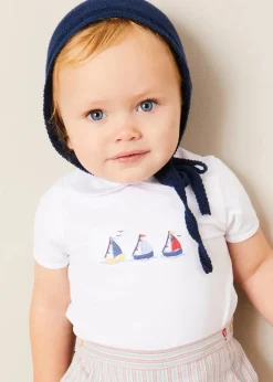 BOY Pepa London Embroidered Boat Motif Peter Pan Collar Bodysuit in White (1mth-3yrs) | Beaufort Striped Button Detail Bloomers in Red (3mths-3yrs) | Plain Cardigan in Navy (6mths-10yrs) | Openwork Knitted Bonnet in Navy (S-L) | T-Bar Pram Shoes in Red (17-20EU) | Ribbed Short Socks - Cream (0mths-10yrs)