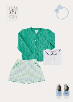 Pepa London Embroidered Scallop Collar Short Sleeve Polo Shirt in Navy (2-10yrs) | Maxwell Gingham Scallop Trim Embroidered Shorts in Green (18mths-10yrs) | Floral Openwork Cotton Cardigan in Green (2-10yrs) | Canvas Plimsolls in Blue (20-35EU) | Blue Linen Big Bow Hairband | Flower Fairies of the Summer Book in White