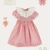Pepa London Emilia Floral Hand Smocked Ruffle Collar Short Sleeve Dress in Pink (12mths-10yrs) | Openwork Cotton Cardigan in Cream (6mths-10yrs) | Girls Ivory Leather Mary Jane Shoes (20-34EU) | Emilia Floral Long Bow Hair Clip in Pink | Openwork short socks White (0mths-8yrs)