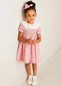 Pepa London Emilia Floral Hand Smocked Ruffle Collar Short Sleeve Dress in Pink (12mths-10yrs) | Openwork Cotton Cardigan in Cream (6mths-10yrs) | Girls Ivory Leather Mary Jane Shoes (20-34EU) | Emilia Floral Long Bow Hair Clip in Pink | Openwork short socks White (0mths-8yrs)