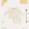 Pepa London Esme Floral Ruffle Collar Long Sleeve Blouse in White (1-12mths) | Esme Floral Bow Detail Bloomers in White (1-12mths) | Openwork Detail Cotton Baby Cardigan in Tangerine (1-12mths) | Lace Detail Knitted Bonnet in Tangerine (1-12mths) | Celebration Ribbon Detail Mary Jane Pram Shoes in Beige (17-20EU) | Esme Floral Dummy Clip in White | Little Library Book in White | White Mouse Toy