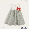 Pepa London Evelyn Floral Sleeveless Bow Detail Trapeze Dress in Red (12mths-8yrs) | Openwork Cotton Cardigan in Cream (6mths-10yrs) | Evelyn Floral Thin Bow Hairband in Red | Openwork short socks White (0mths-8yrs)