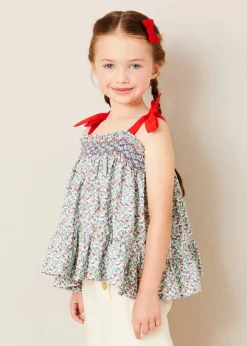 Pepa London Evelyn Floral Smock Detail Tie Strap Blouse in Red (4-10yrs) | Wide Leg Front Button Trousers in Beige (2-10yrs) | Mariner Collar Bold Stripe Jumper in White (2-10yrs) | Plain Linen Small Bow Hair Clip in Red