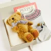 Pepa London Gift boxes | Fair Isle Knitted 2 Piece Set In Grey (1-9mths) | Intricate Openwork Fine Merino Wool Shawl in Cream | BIBS Dummy in Sage Green | Bunny Teether in Green | Peepo Book In Red