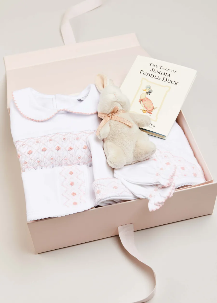 Pepa London Gift boxes | Pink Hand Smocked Cotton All-in-One (0-12mths) | Newborn Hat with Pink Hand Smocked Detail (0-3mths) | Pink Hand Smocked Bib | Pink Hand Smocked Towel | Pink Hand Smocked Mittens
