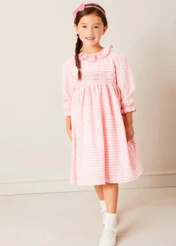 Pepa London Gingham Smocked Ruffle Collar Long Sleeve Dress in Coral (12mths-10yrs) | Floral Openwork Cotton Cardigan in Pink (2-10yrs) | Girls Ivory Leather Mary Jane Shoes (20-34EU) | Raspberry Linen Hairband | Openwork short socks White (0mths-8yrs)