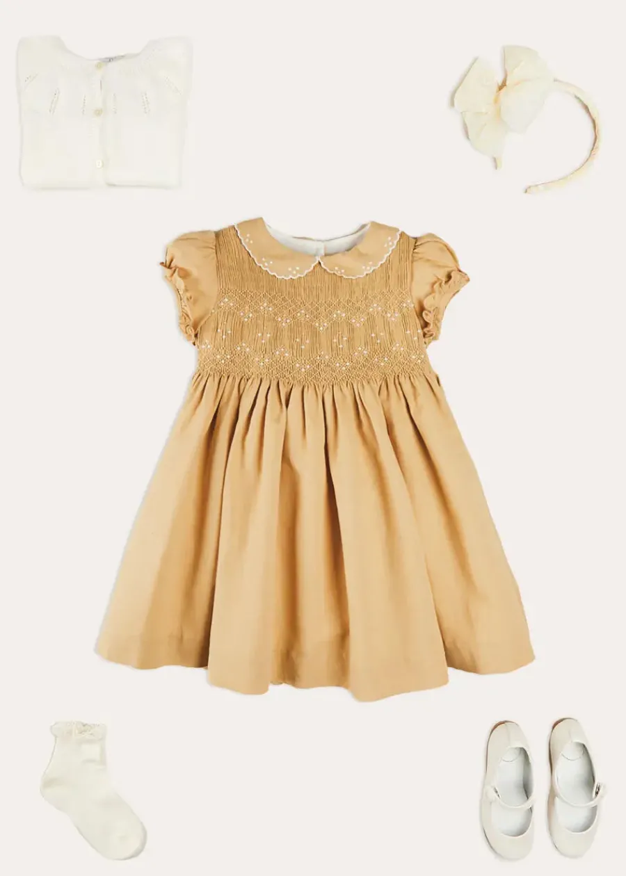 Pepa London Hand Smocked Peter Pan Collar Short Sleeve Dress in Beige (12mths-10yrs) | Openwork Cotton Cardigan in Cream (6mths-10yrs) | Girls Ivory Leather Mary Jane Shoes (20-34EU) | Traditional Big Bow Tulle Hairband in Ivory | Celebration Short Socks with Ruffle- Cream (0mths-10yrs) | Tulle Long Bow Clip In Cream