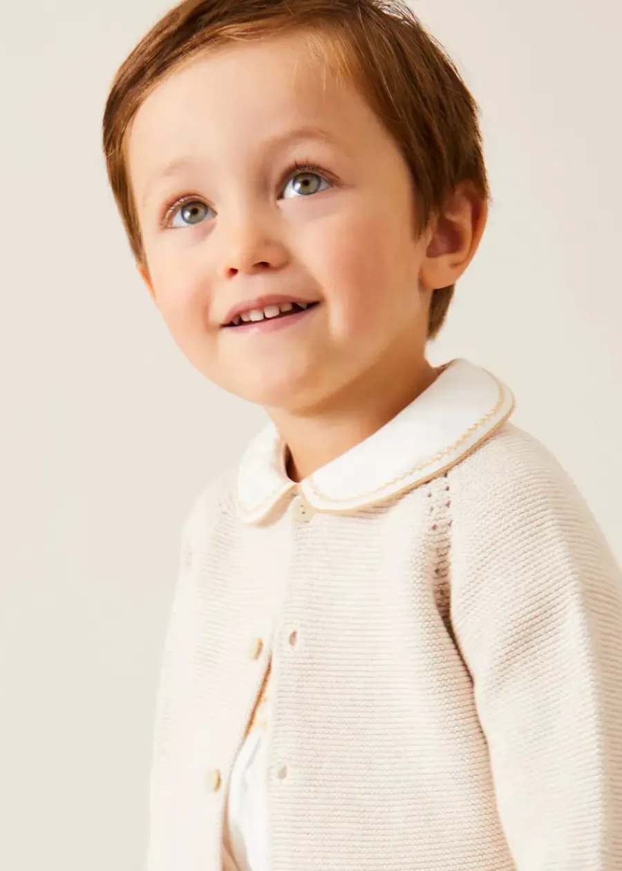 BOY Pepa London Hand Smocked Peter Pan Collar Short Sleeve Two Piece Set in Beige (18mths-6yrs) | Plain Cardigan in Cream (6mths-10yrs) | T-Bar Leather Baby Shoes in Ivory (20-24EU) | Cotton Short Socks Cream (0mths-10yrs)