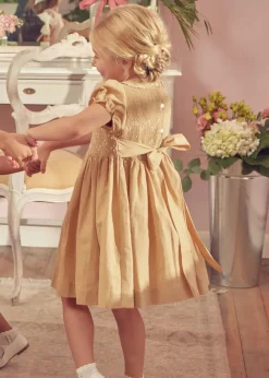 Pepa London Hand Smocked Peter Pan Collar Short Sleeve Dress in Beige (12mths-10yrs) | Openwork Cotton Cardigan in Cream (6mths-10yrs) | Mary Jane Leather Baby Shoes in Ivory (20-24EU) | Traditional Big Bow Tulle Hairband in Ivory | Celebration Short Socks with Ruffle- Cream (0mths-10yrs)