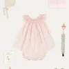 Pepa London Hand Smocked Sleeveless Dress With Bloomers in Pink (1-12mths) | Openwork Detail Baby Cardigan in Pink (1-12mths) | Openwork Knitted Bonnet in Beige(S-L) | Cordelia Liberty Floral Mary Jane Pram Shoes in Pink (17-20EU) | Cordelia Liberty Floral Dummy Clip in Pink | Knitted Bunny Teether in Beige | BIBS Dummy in Pink