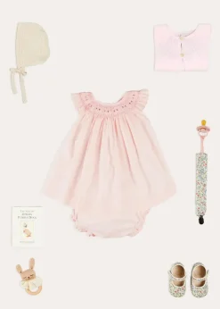 Pepa London Hand Smocked Sleeveless Dress With Bloomers in Pink (1-12mths) | Openwork Detail Baby Cardigan in Pink (1-12mths) | Openwork Knitted Bonnet in Beige(S-L) | Cordelia Liberty Floral Mary Jane Pram Shoes in Pink (17-20EU) | Cordelia Liberty Floral Dummy Clip in Pink | Knitted Bunny Teether in Beige | BIBS Dummy in Pink