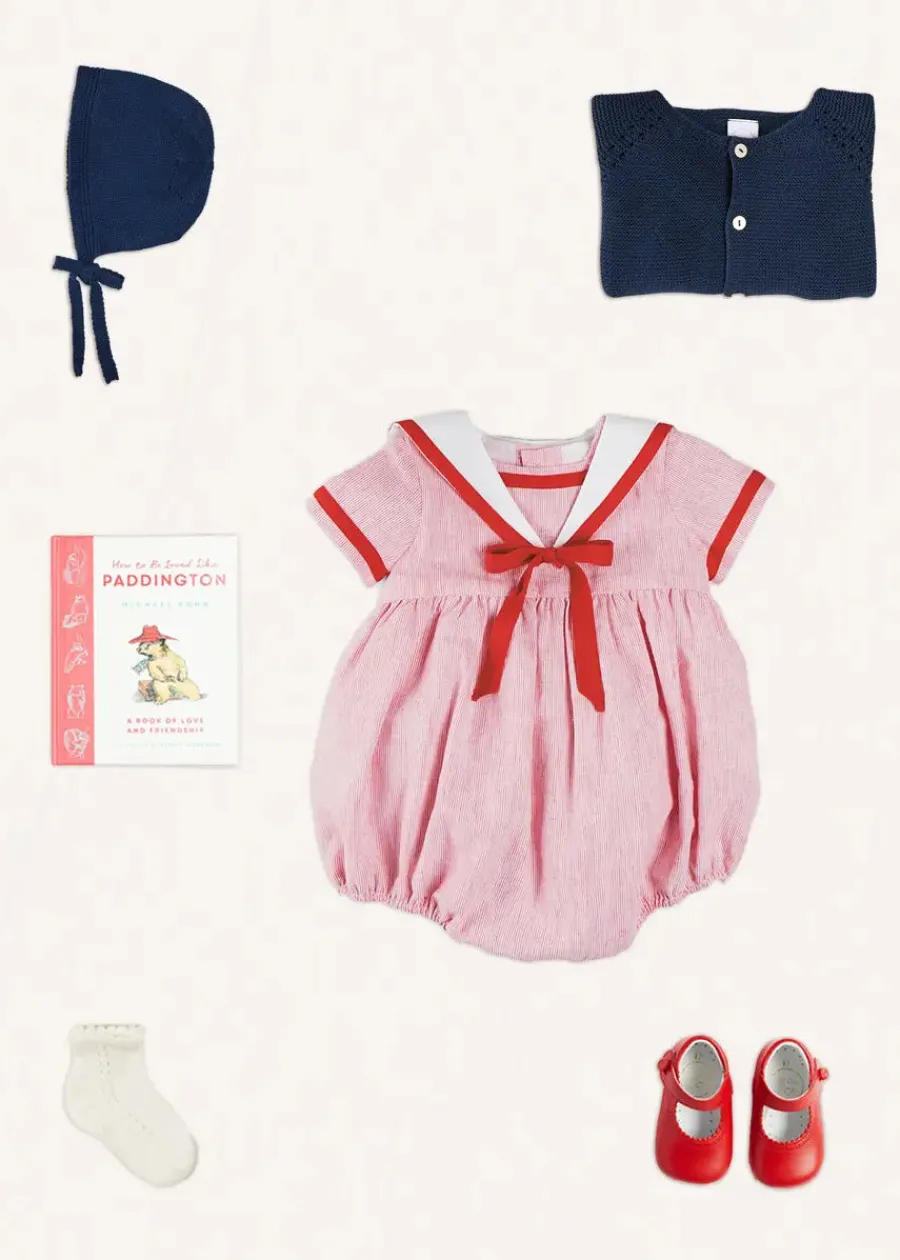 Pepa London Lawrence Striped Mariner Collar Short Sleeve Romper in Red (6mths-3yrs) | Openwork Knitted Bonnet in Navy (S-L) | Plain Cardigan in Navy (6mths-10yrs) | Leather Mary Jane Pram Shoes in Red (17-20EU) | Openwork short socks White (0mths-8yrs)