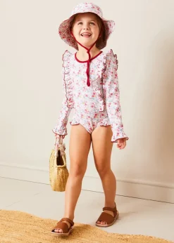 Pepa London Louisa Floral Ruffle Trim Long Sleeve Swimsuit in Pink (2-10yrs) | Louisa Floral Beach Hat in Pink (S-M) | Open Toe Leather Sandals in Brown (17-30EU) | Louisa Floral Detail Raffia Bag in Coral