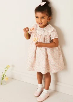 Pepa London Mabel Floral Statement Collar Short Sleeve Dress in Coral (12mths-10yrs) | Plain Cardigan in Cream (6mths-10yrs) | Mary Jane Baby Shoes in Pink (20-26EU) | Mabel Floral Hairband in Coral | Openwork short socks White (0mths-8yrs)