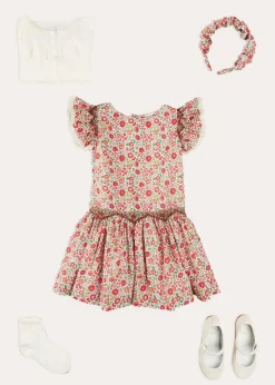 Pepa London Margot Floral Sleeveless Hand-Smocked Dress in Red Made with Liberty Fabric (4-12yrs) | Openwork Cotton Cardigan in Cream (6mths-10yrs) | Girls Ivory Leather Mary Jane Shoes (20-34EU) | Margot Liberty Floral Scrunchie Hairband in Red | Openwork short socks White (0mths-8yrs)