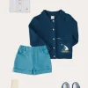 BOY Pepa London Nautical Boat Embroidery Polo Collar Cardigan in Blue (12mths-6yrs) | Chesham Striped Mao Collar Long Sleeve Shirt in Red (3-10yrs) | Plain Elasticated Shorts in Blue (12mths-4yrs) | T-Bar Baby Shoes in Blue (20-26EU) | Ribbed Short Socks in Beige (0mths-10yrs)