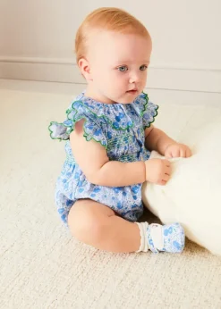 Pepa London Olivia Floral Smocked Ruffle Collar Sleeveless Romper in Blue (6mths-2yrs) | Plain Cardigan in Navy (6mths-10yrs) | Openwork Knitted Bonnet in Navy (S-L) | Olivia Floral Mary Jane Pram Shoes in Blue (17-20EU) | Openwork short socks White (0mths-8yrs) | Flower Fairies of the Summer Book in White