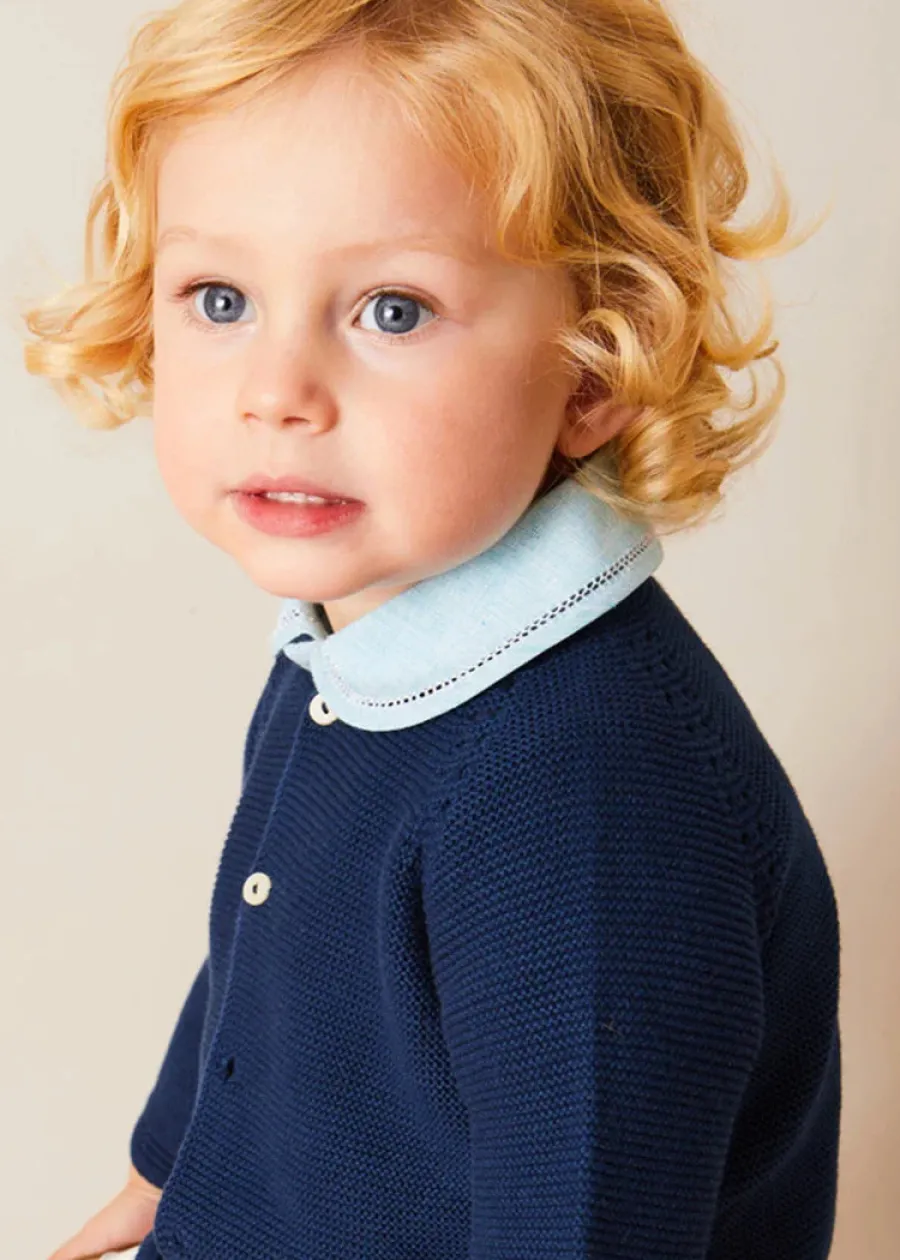 BOY Pepa London Peter Pan Collar Trim Detail Short Sleeve Shirt in Blue (12mths-5yrs) | Brompton Striped Shorts With Braces in Beige (12mths-4yrs) | Plain Cardigan in Navy (6mths-10yrs) | Woven T-Bar Baby Shoes in Navy (20-26EU) | Brompton Striped Sun Hat in Beige (XS-M) | Ribbed Short Socks - Cream (0mths-10yrs)