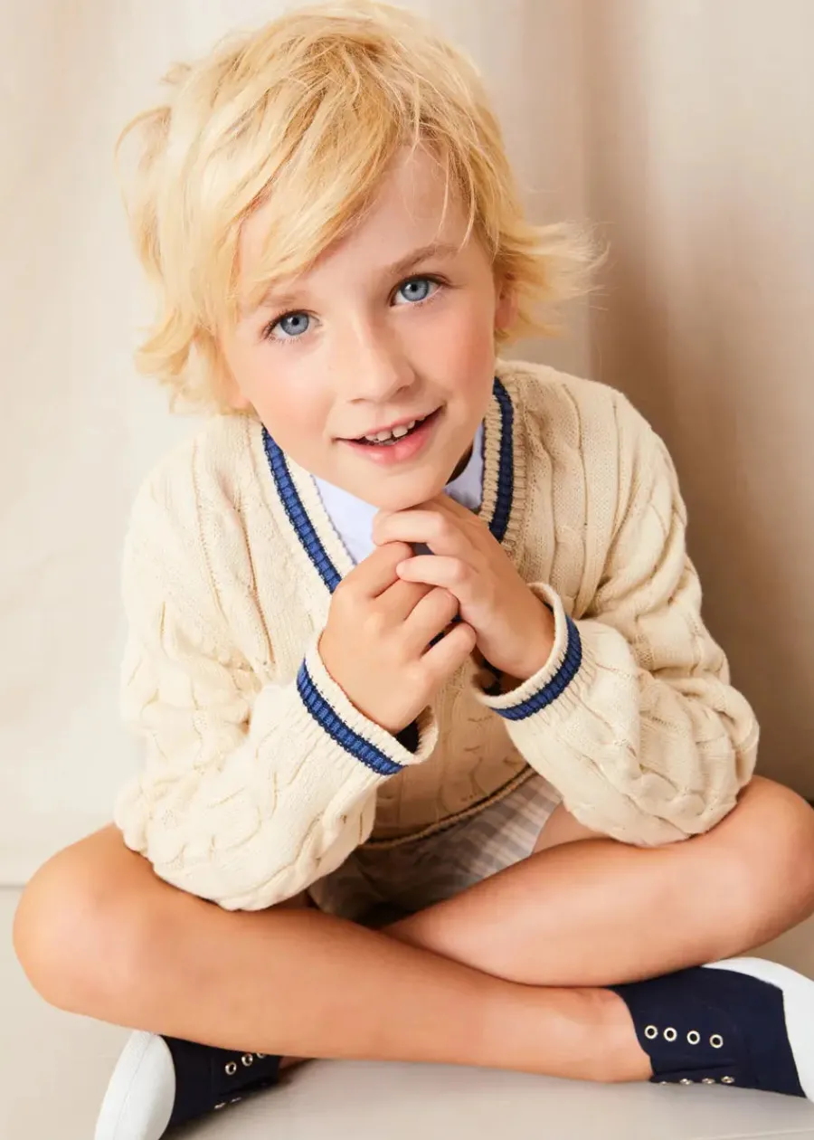 BOY Pepa London Plain Mao Collar Long Sleeve Shirt in Blue (4-10yrs) | Brompton Striped Shorts in Beige (4-10yrs) | Cable Knit V-Neck Jumper in Cream (4-10yrs) | Canvas Plimsolls in Navy (20-35EU) | Cream Boy's Belt