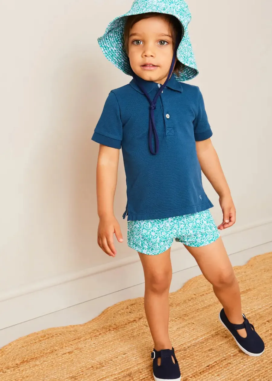 BOY Pepa London Plain Short Sleeve Polo Shirt in Navy (2-10yrs) | Adelaide Floral Swim Shorts in Green (12mths-4yrs) | Adelaide Floral Beach Hat in Green (S-M)