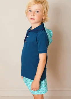 BOY Pepa London Plain Short Sleeve Polo Shirt in Navy (2-10yrs) | Adelaide Floral Tie Detail Swim Shorts in Green (2-10yrs) | Suede Buckle Detail Sandals in Beige (28-35EU) | Adelaide Floral Beach Hat in Green (S-M) | Big Brother Beach Mouse Toy