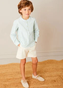BOY Pepa London Safari Button Detail Cardigan in Camel (4-10yrs) | Maxwell Gingham Mao Collar Long Sleeve Shirt in Green (3-10yrs) | Plain Cotton Shorts in White (4-10yrs) | Suede Lace-up Espadrilles in Beige (24-35EU) | The Christopher Robin Collection Book