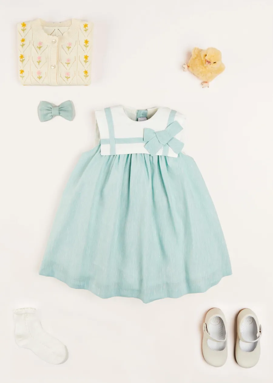 Pepa London Sleeveless Trapeze Dress With Bow Detail in Green (12mths-10yrs) | Green Linen Hairband | Mary Jane Leather Baby Shoes in Ivory (20-24EU) | Openwork short socks White (0mths-8yrs) | Chick Toy in Yellow