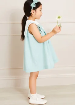 Pepa London Sleeveless Trapeze Dress With Bow Detail in Green (12mths-10yrs) | Green Linen Hairband | Mary Jane Leather Baby Shoes in Ivory (20-24EU) | Openwork short socks White (0mths-8yrs) | Chick Toy in Yellow