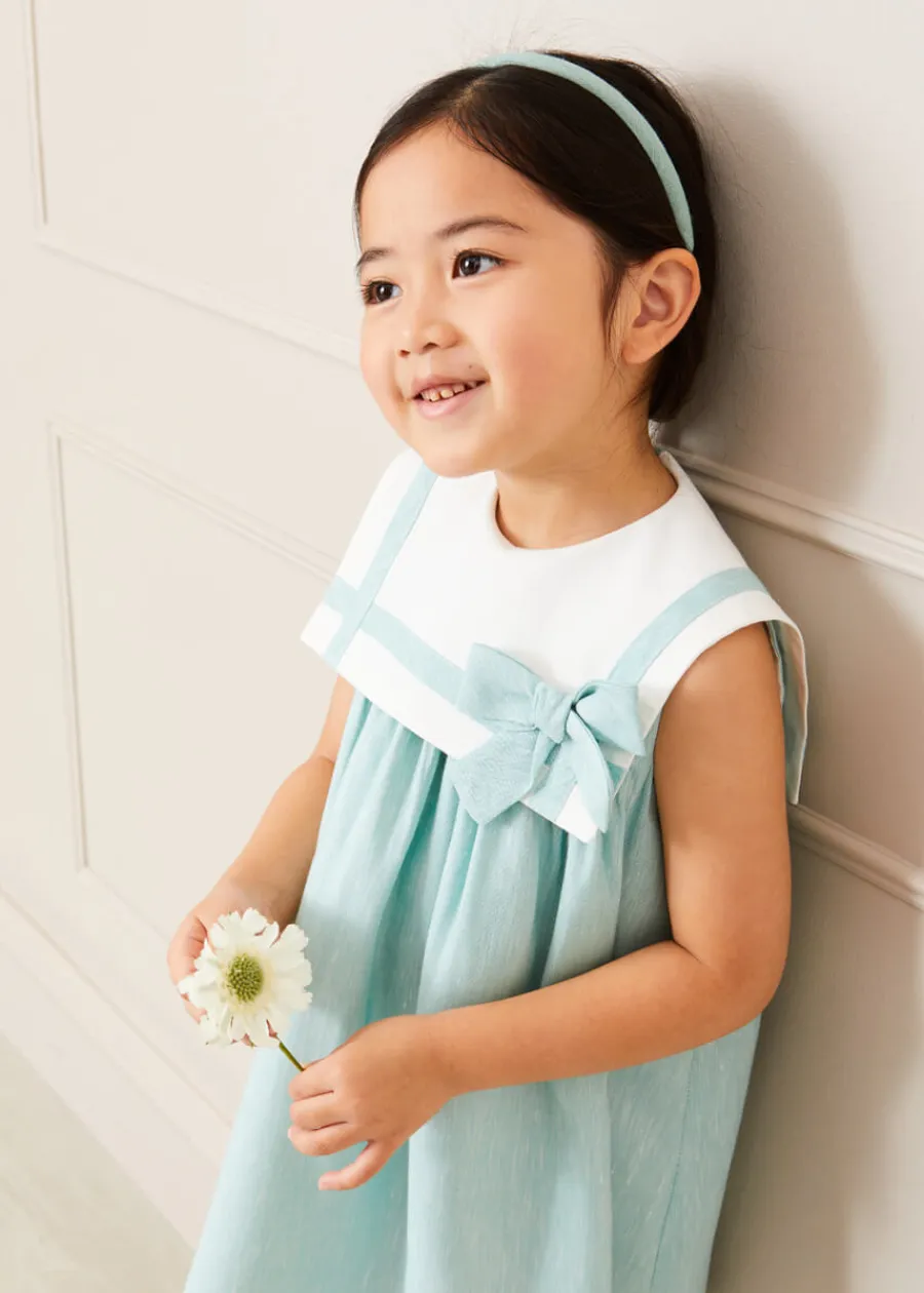 Pepa London Sleeveless Trapeze Dress With Bow Detail in Green (12mths-10yrs) | Green Linen Hairband | Mary Jane Leather Baby Shoes in Ivory (20-24EU) | Openwork short socks White (0mths-8yrs) | Chick Toy in Yellow