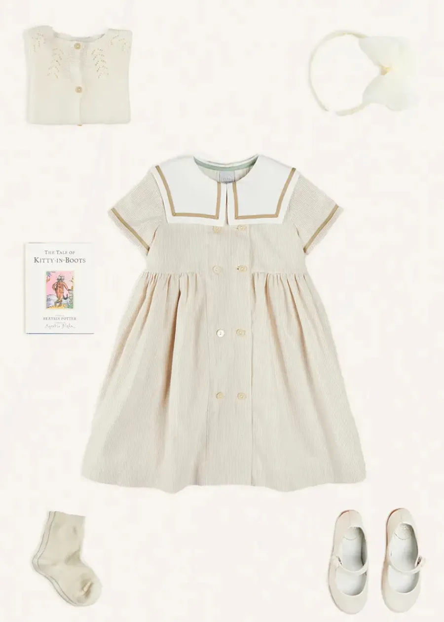 Pepa London Waterford Striped Mariner Collar Double Breasted Short Sleeve Dress in Beige (12mths-10yrs) | Openwork Cotton Cardigan in Cream (6mths-10yrs) | Girl's Beige Leather Celebration Shoes (20-34EU) | Tulle Long Bow Clip In Cream | Cotton Short Socks Cream (0mths-10yrs)