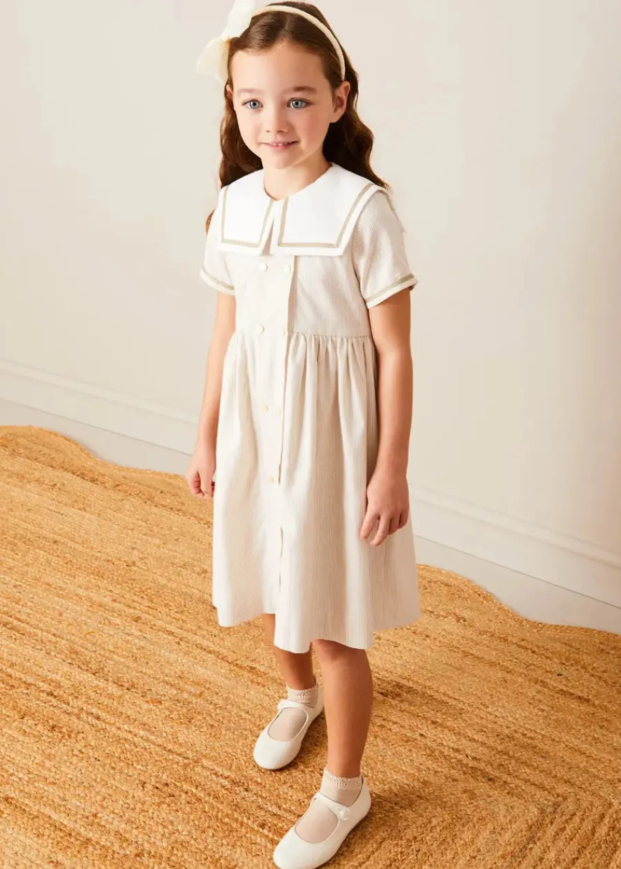 Pepa London Waterford Striped Mariner Collar Double Breasted Short Sleeve Dress in Beige (12mths-10yrs) | Openwork Cotton Cardigan in Cream (6mths-10yrs) | Girl's Beige Leather Celebration Shoes (20-34EU) | Tulle Long Bow Clip In Cream | Cotton Short Socks Cream (0mths-10yrs)